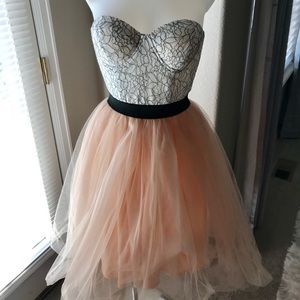 Strapless bandeau top with mesh skirt dress.